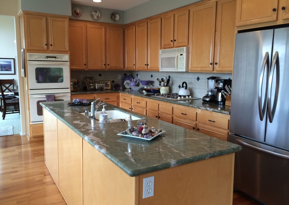 Great kitchen for visiting with friends while cooking. Overlooks backyard