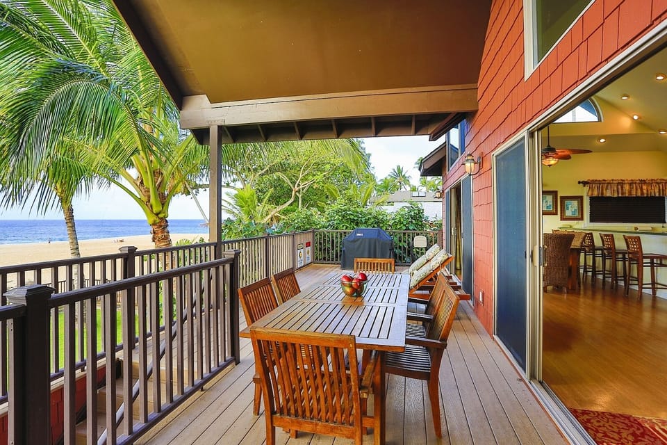 The deck has covered outdoor dining, a gas grill and 2 chaise lounges.
