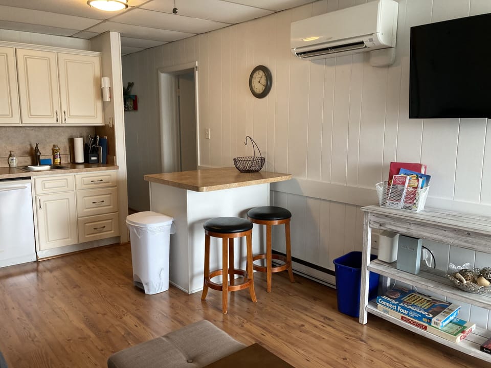 Kitchen area has counter seating for 2