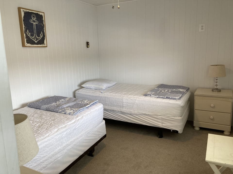 Second bedroom has 2 twin beds and a view of the canal