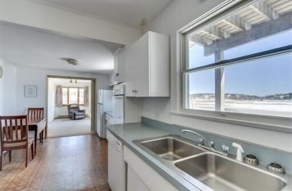 Large eat-in kitchen and family room with back deck and amazing water views.