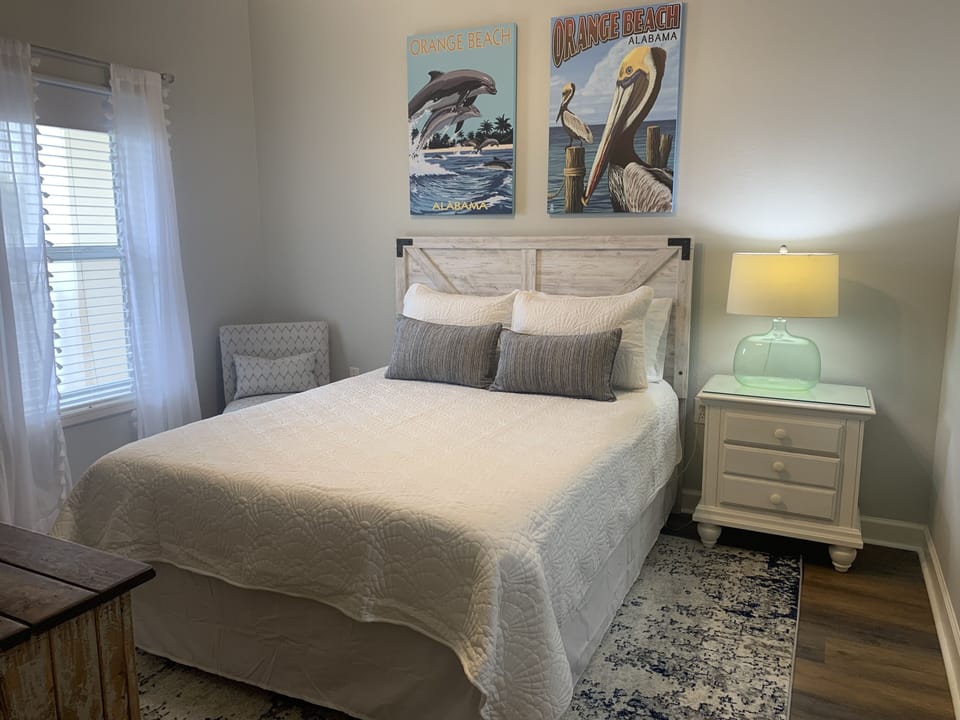 Bedroom 3. Queen size bed, nightstand, dresser, walk in closet, attached bath
