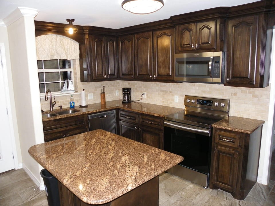 BRAND New Downstairs Kitchen with granite, custom cabinets and new appliances.