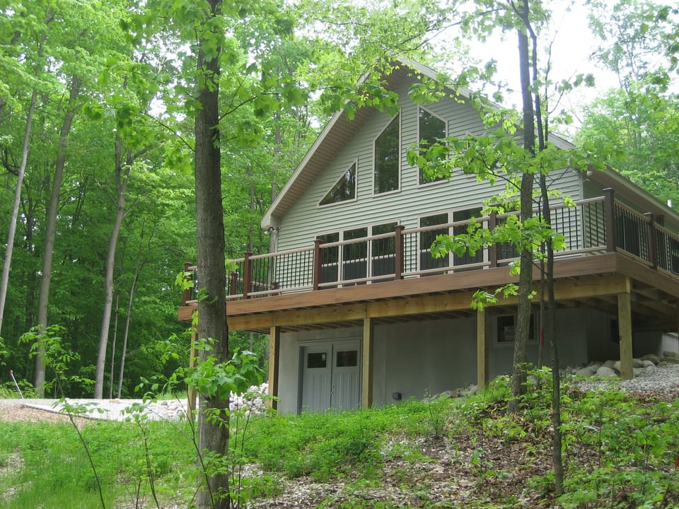 Private wooded location; spacious wraparound deck