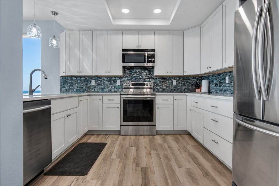Tray ceiling lights up this beautifully designed kitchen.