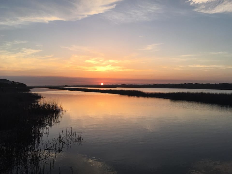 Sit on the dock, just steps away, to watch beautiful sunsets