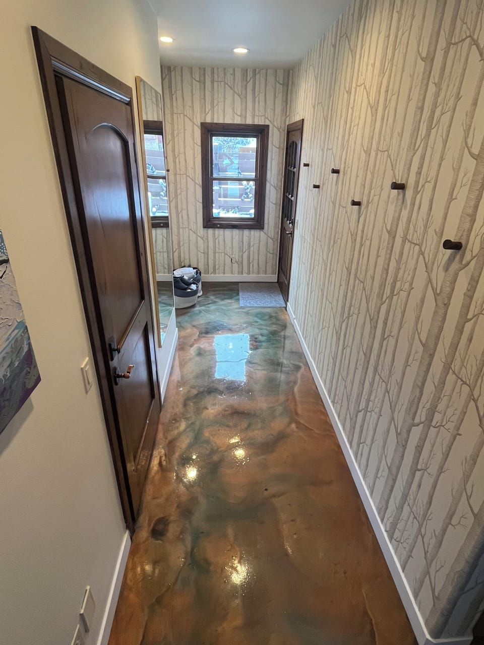 Side entrance to ski room for jackets and outerwear, also connects to garage