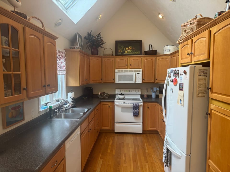 Well appointed, kitchen with cookware, dishware, utensils, toaster and Kurig