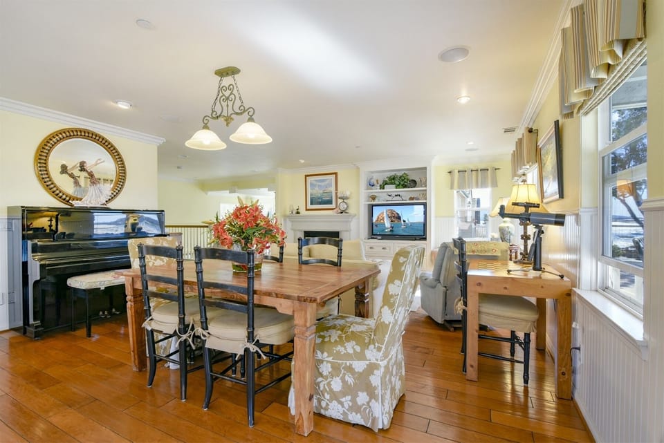 The living room/dining area is beautifully furnished with great art throughout.