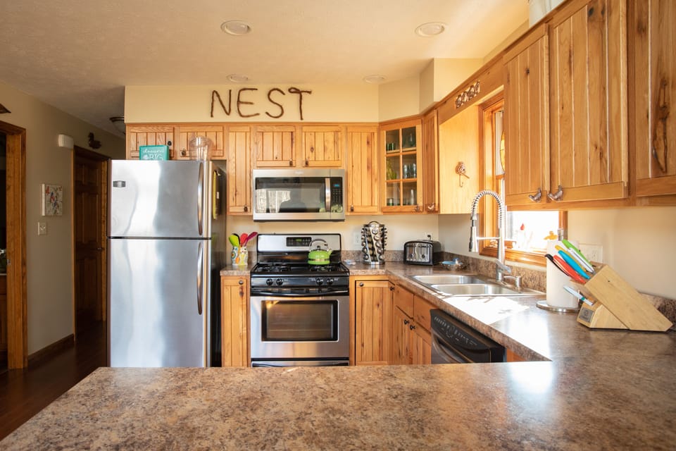 Kitchen with plenty of prep room.  gas stove, micro wave, dishwasher and fridge.