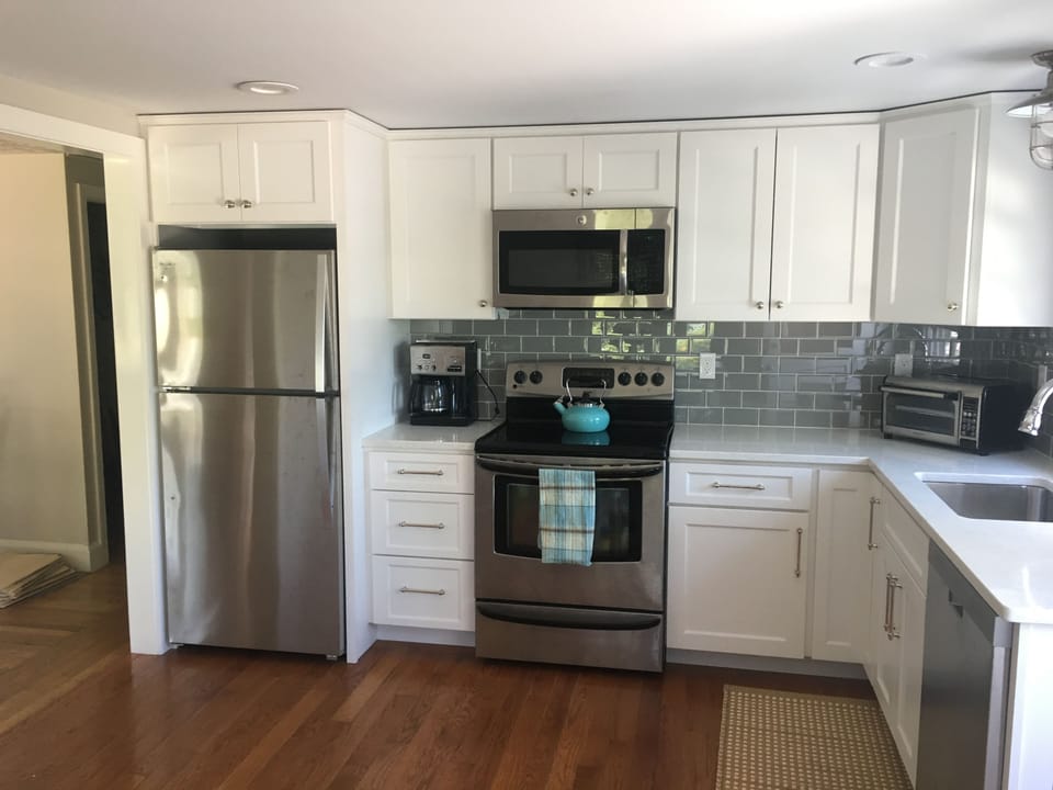 Well stocked Kitchen which open up to second level deck. 