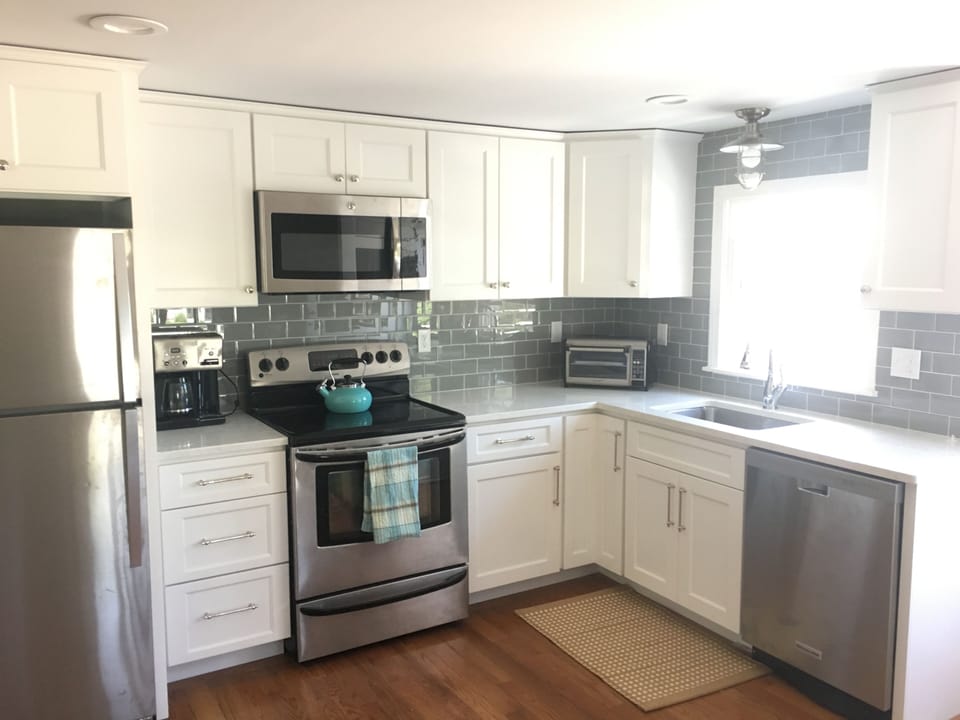Eat in kitchen with deck right off. Includes new quartz counter tops!