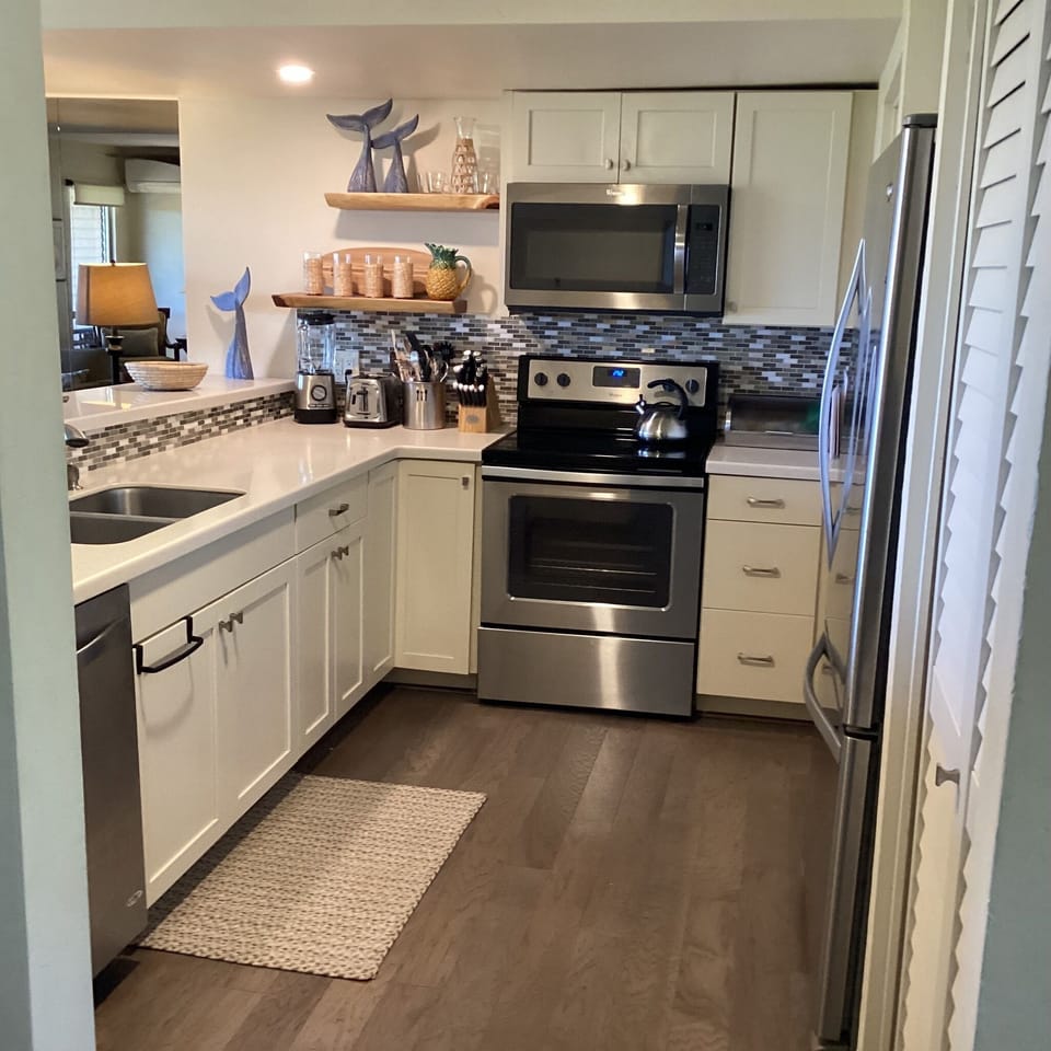 Kitchen is well stocked for cooking & eating in