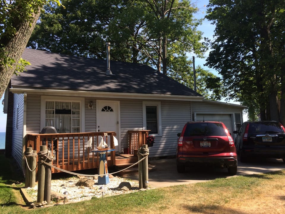Front entrance and parking in front of garage