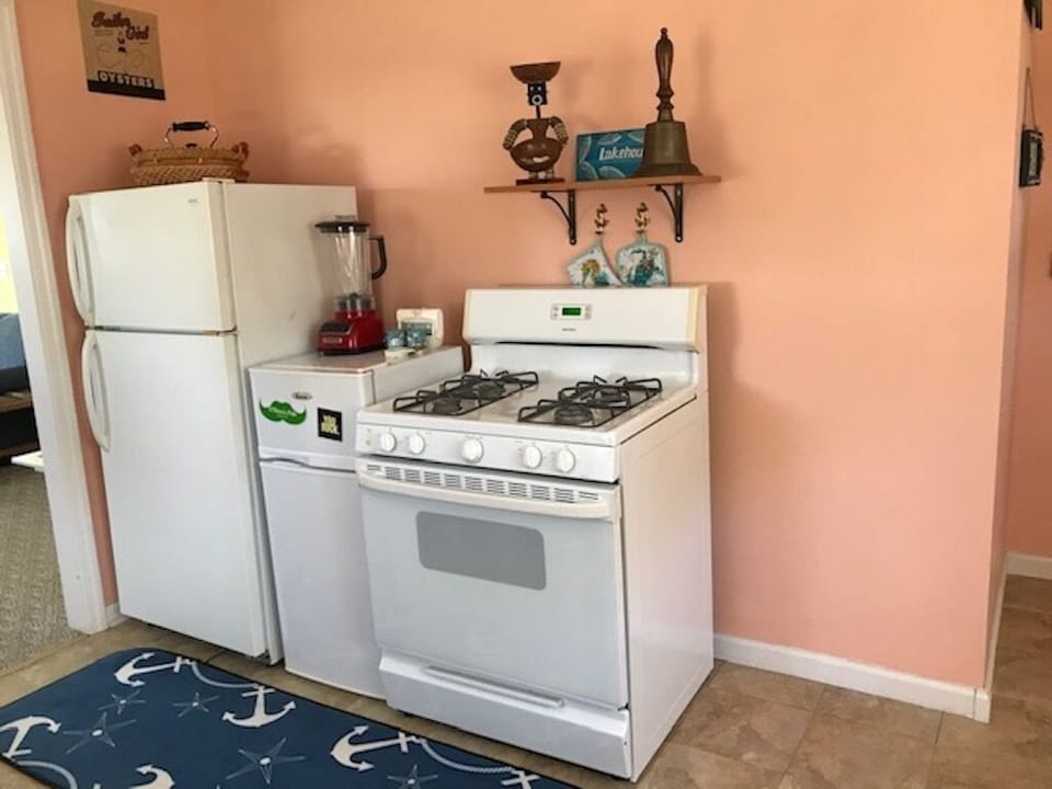 Spacious kitchen includes a gas range/oven and full size refrigerator. 