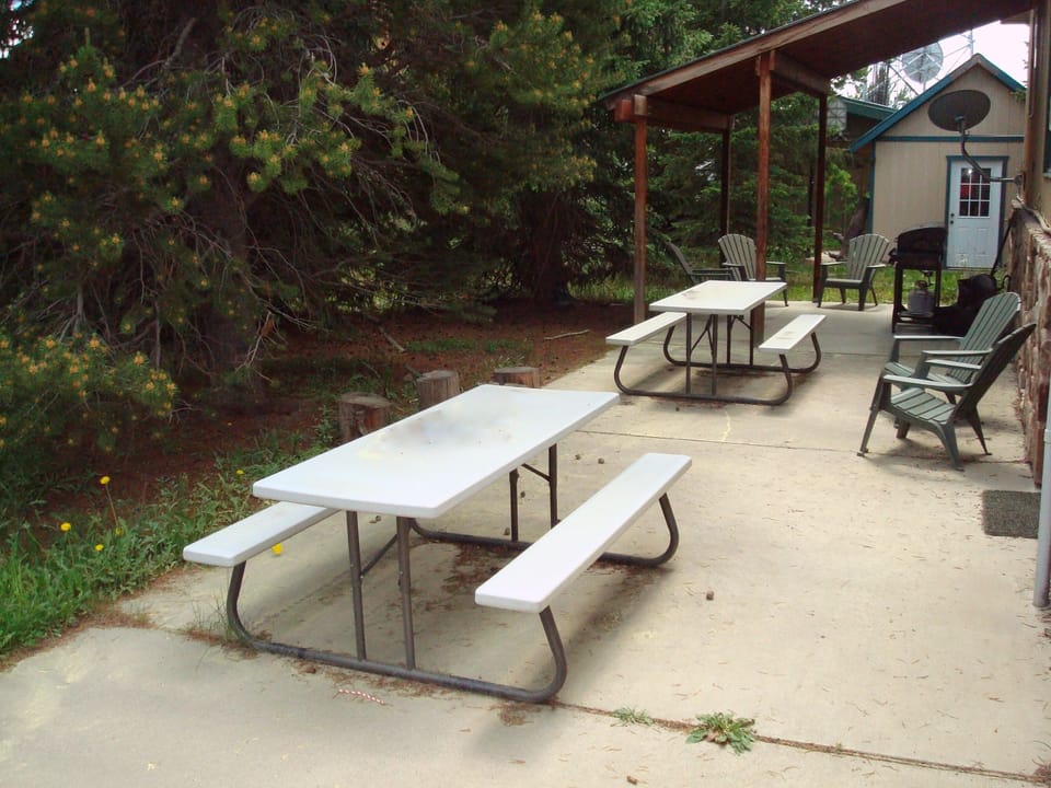 The backyard patio lets you lounge in sun or shade, relax together & share meals