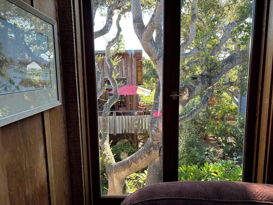 Livingroom view to private deck off master bedroom with shade umbrella