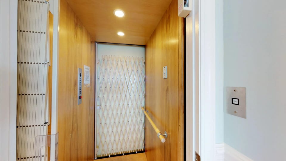 Elevator stops at driveway, game room, and kitchen level.