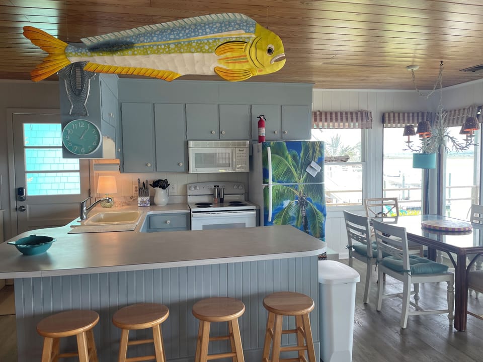 Open, fully stocked kitchen. Island seating for 4. 
