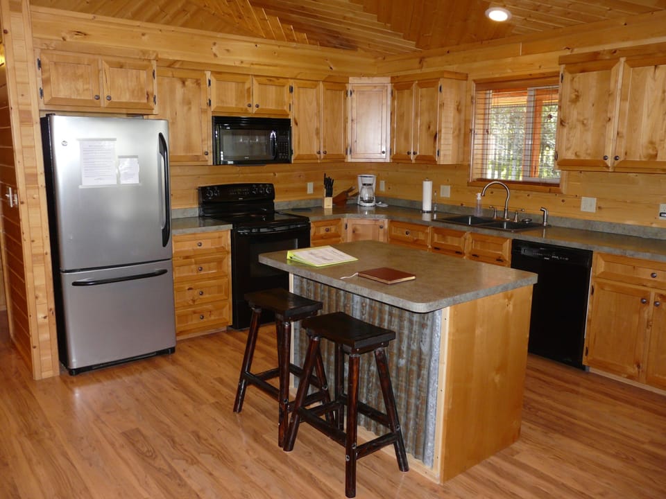 The fully equipped upstairs kitchen  has everything you'll need for cooking.