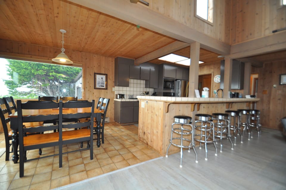 Seating for up to 14.  8 at the table and 6 at the bar.