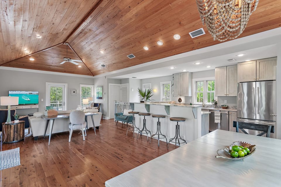 Great room with tons of natural light and 2 porches, patio and grill. 