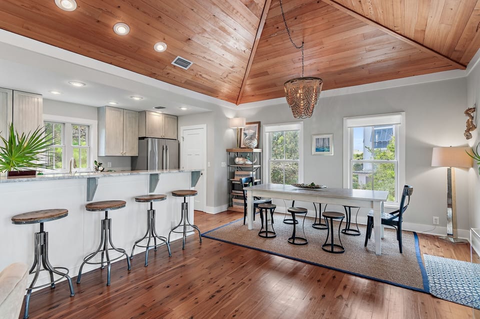 Quartzite counters, bartop seating, dining table, open fun entertainment space