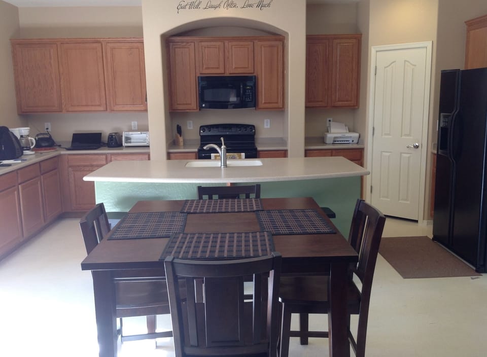 Dining table and three bar stools.