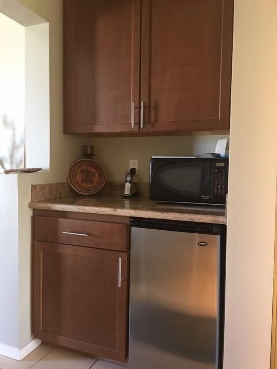 Kitchenette with coffee maker, microwave and fridge
