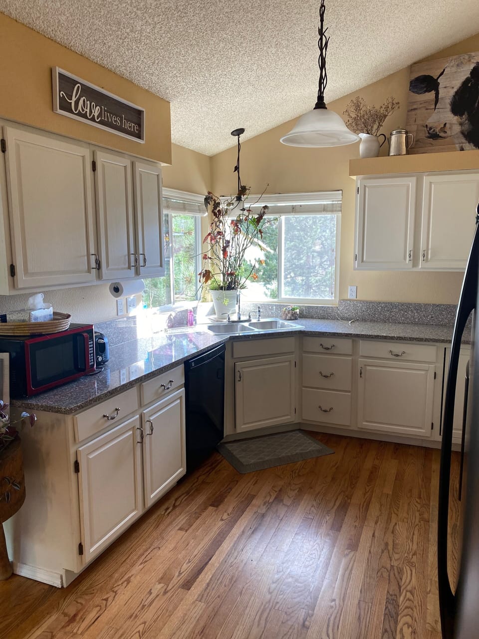 Kitchen with granite counter tops and updated appliances. 