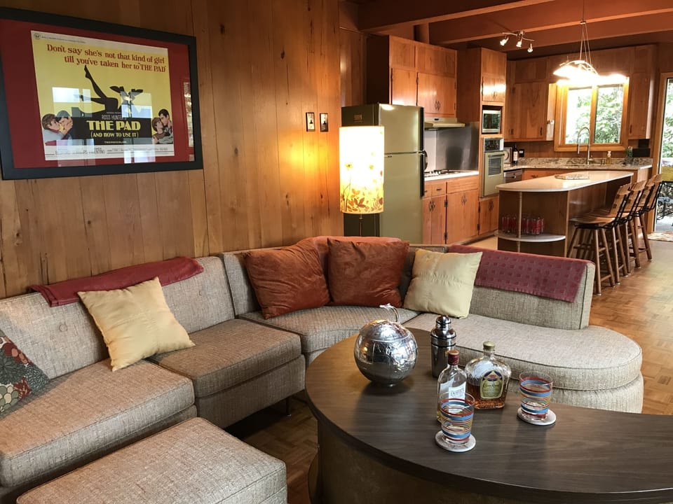Newly upholstered 1960s sectional and 1963 Grand Server coffee table
