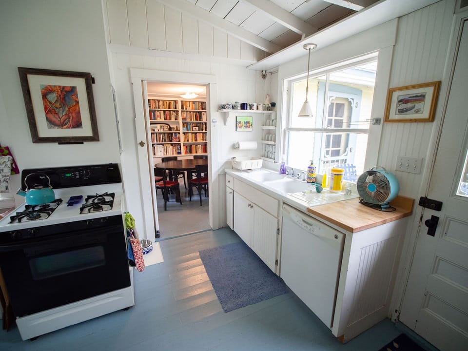 A view from the kitchen to the dinning room.