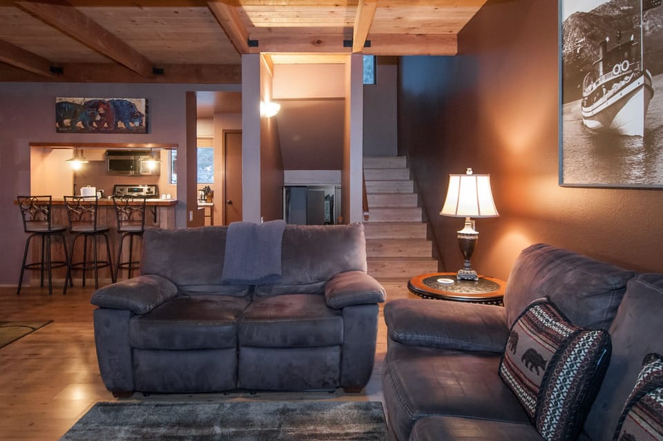 Living room looking towards stairs to upper and lower floors.