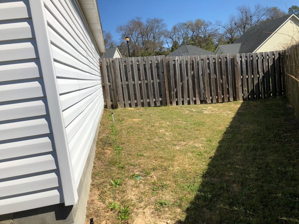Fenced in backyard (grill and outdoor table not shown but included)