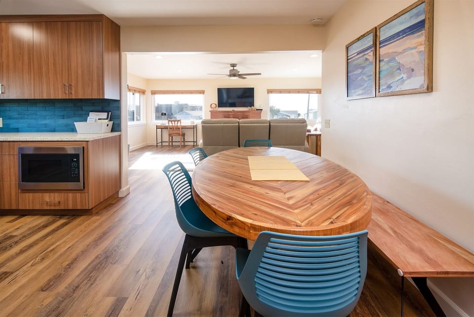 The dining room has an open floor to the living room
