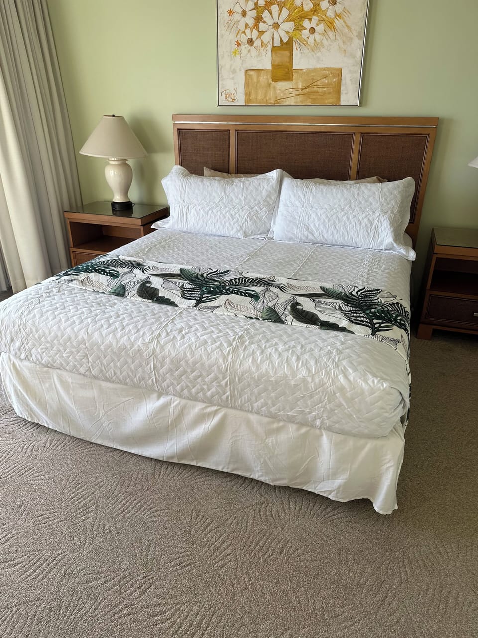 Comfortable king sized bed with cozy new bedding