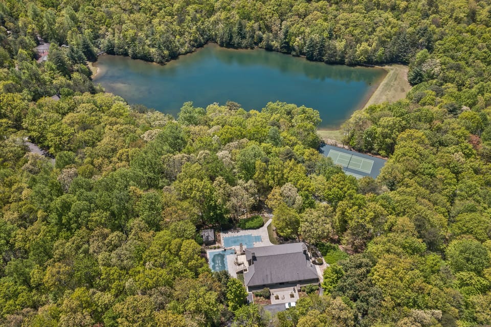 Aeriel View Clubhouse, Lake, and Tennis Court