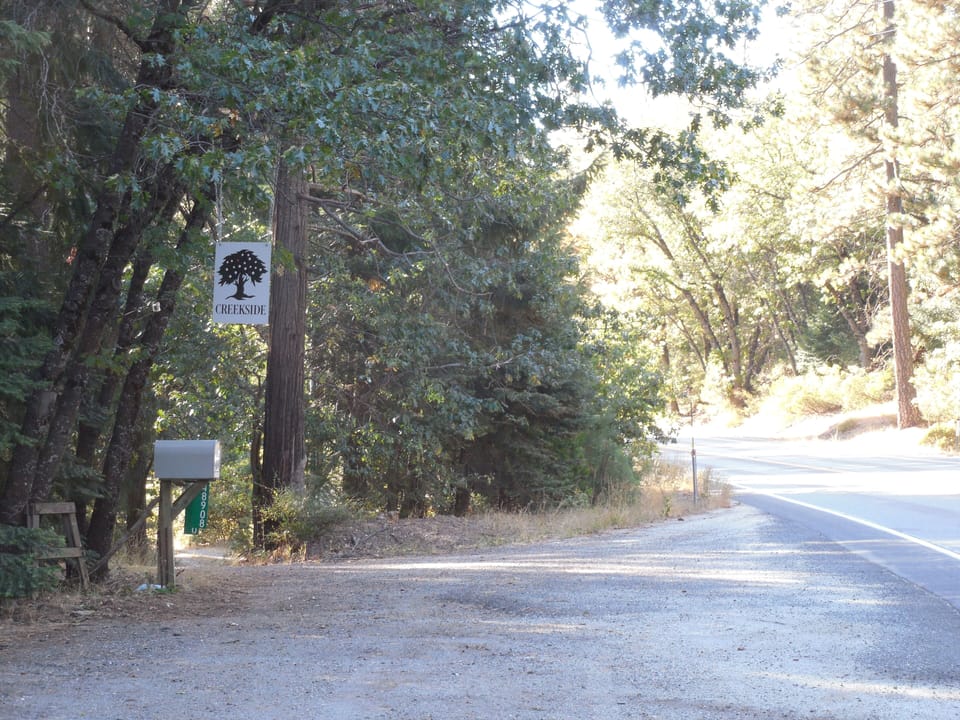 "CREEKSIDE" sign at driveway!