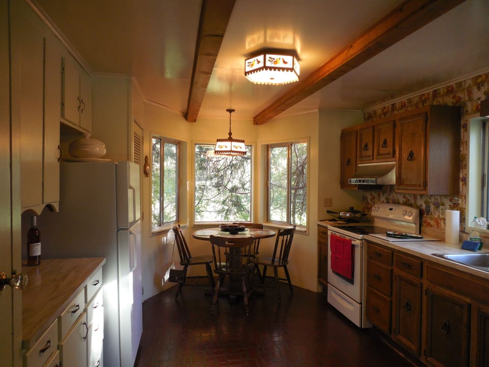 Kitchen and the breakfast nook, which looks out over the creek.