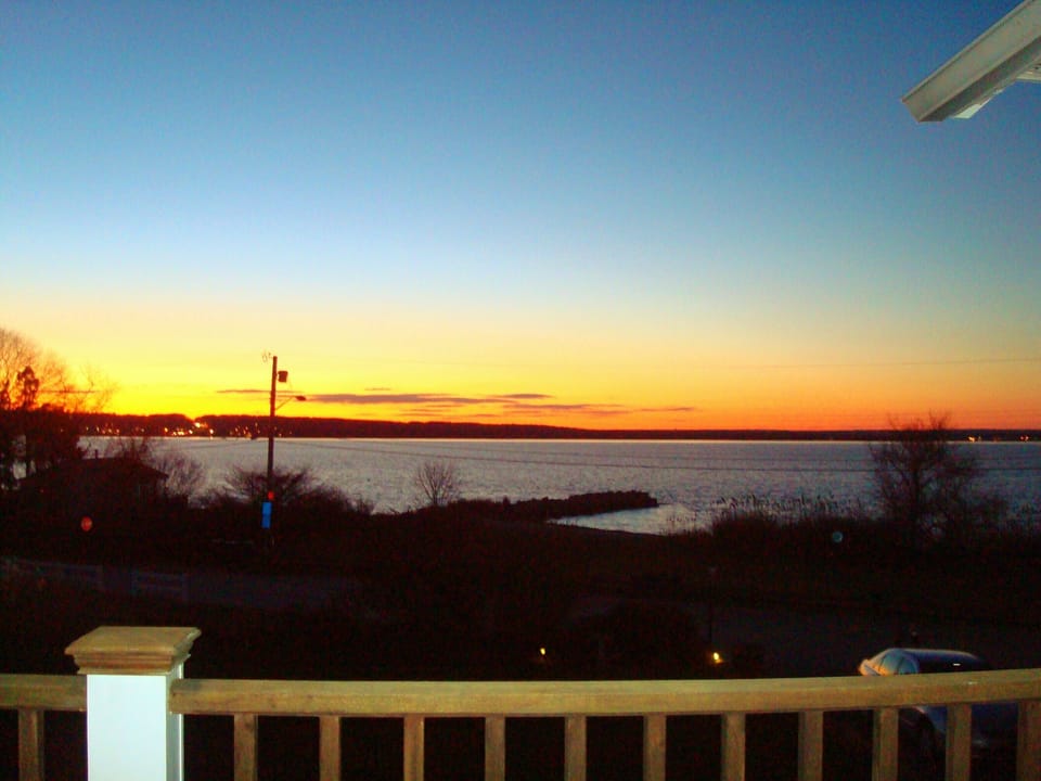 View of the sunset and beach across the street from the top deck.