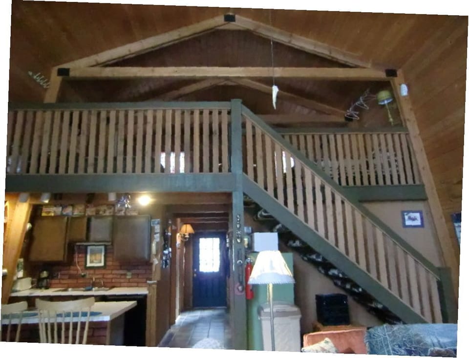 LOOKING UP STAIRS TO LOFT