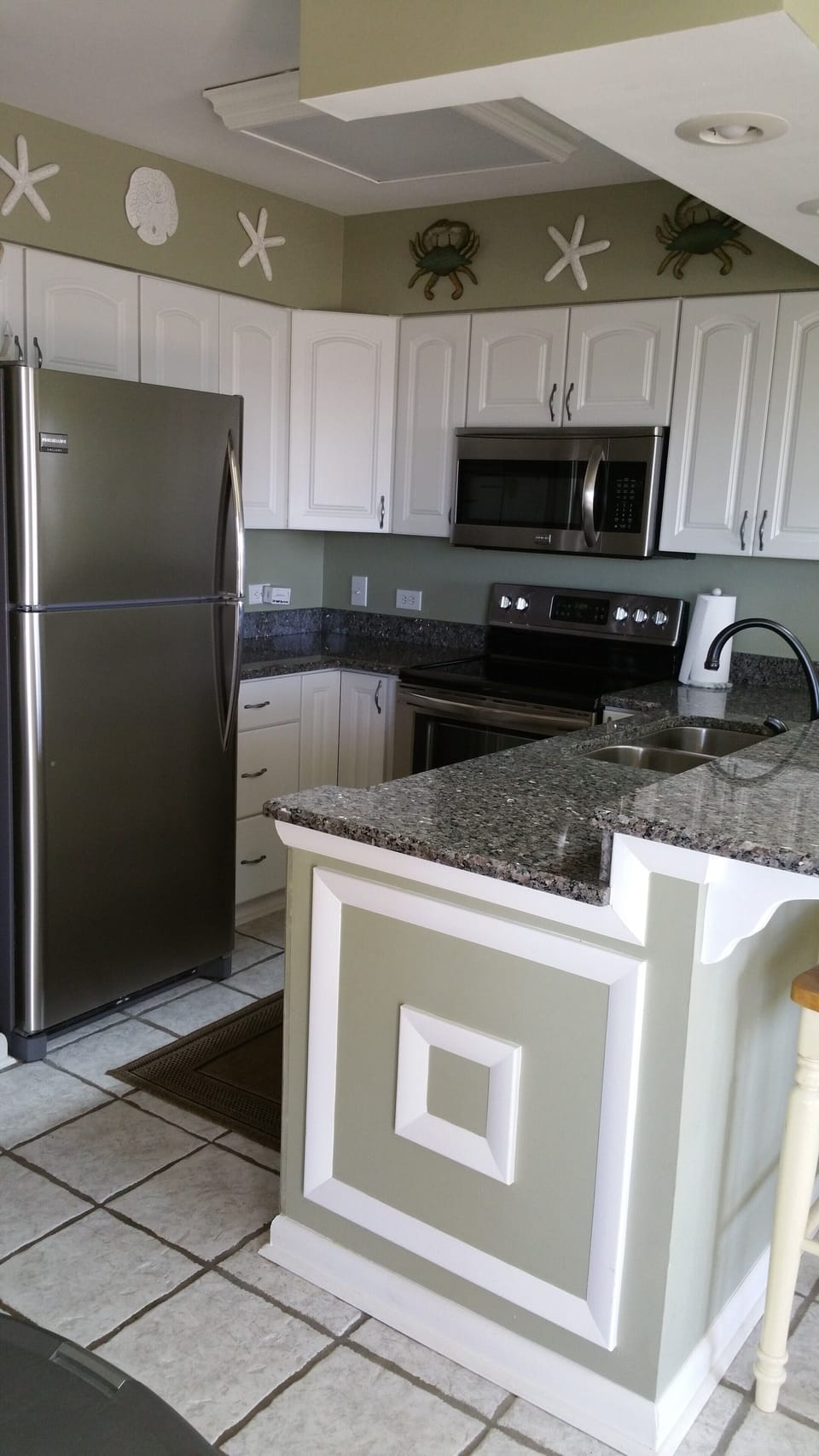 Updated kitchen with stainless steel appliances.