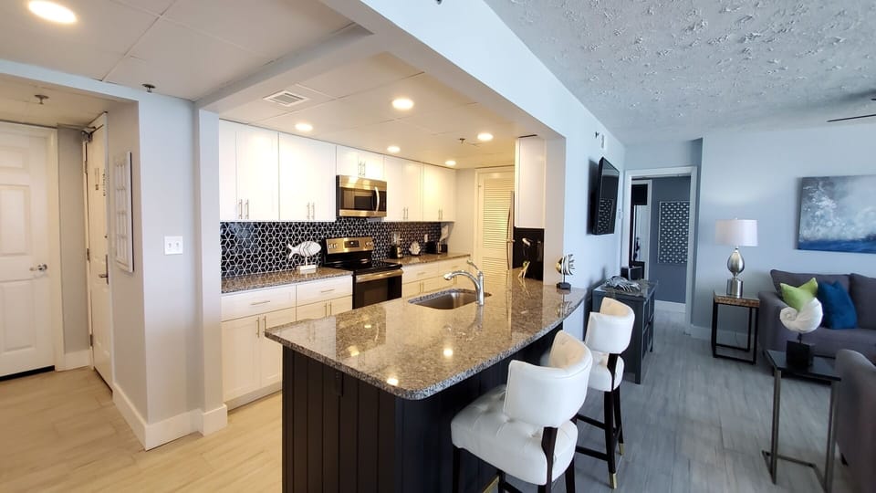 Open kitchen plan with granite counter tops and new cabinets
