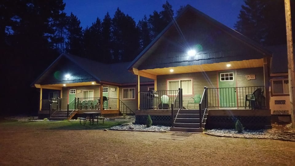 Evening at Lazy Bear. Automated deck lights and security light in parking area.