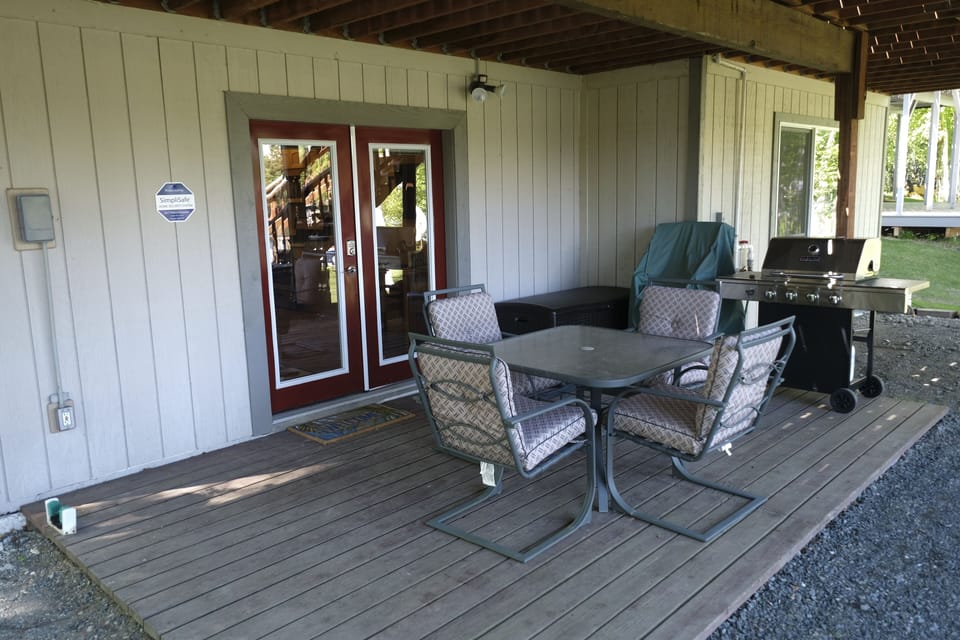 Deck table, chairs, barbecue, extra chairs