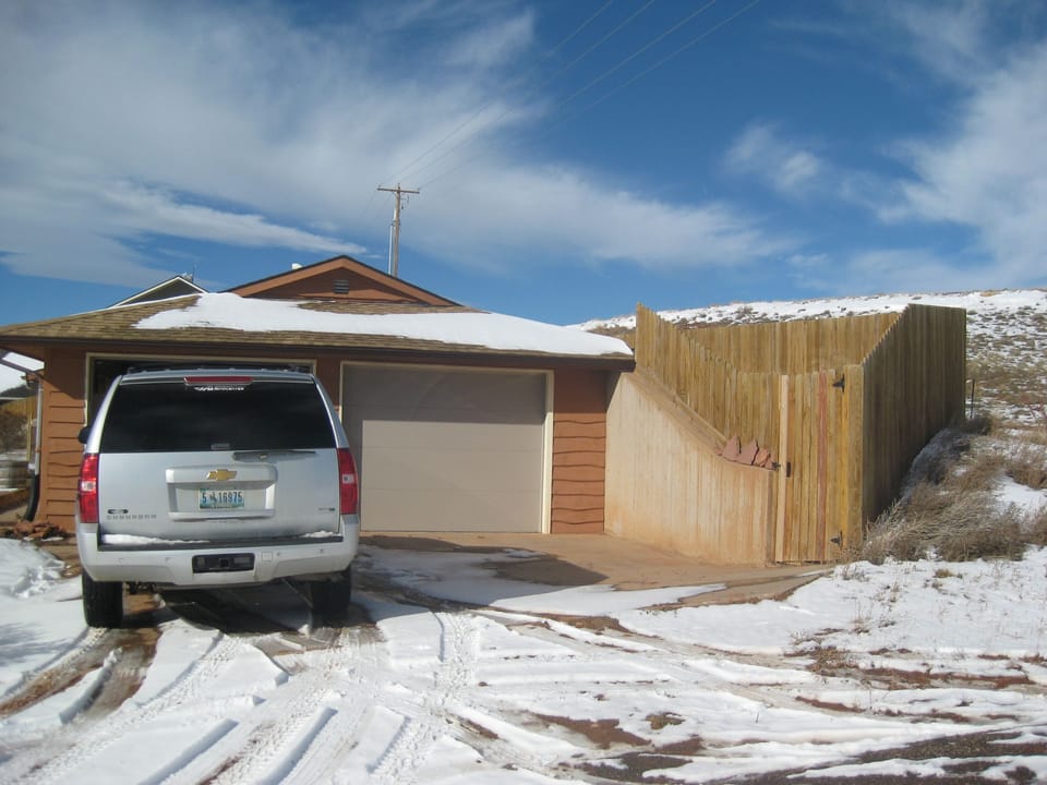 Garage access. Hill to right presents panoramic views.