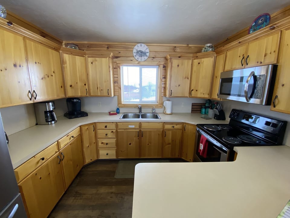 well equipped kitchen with new appliances