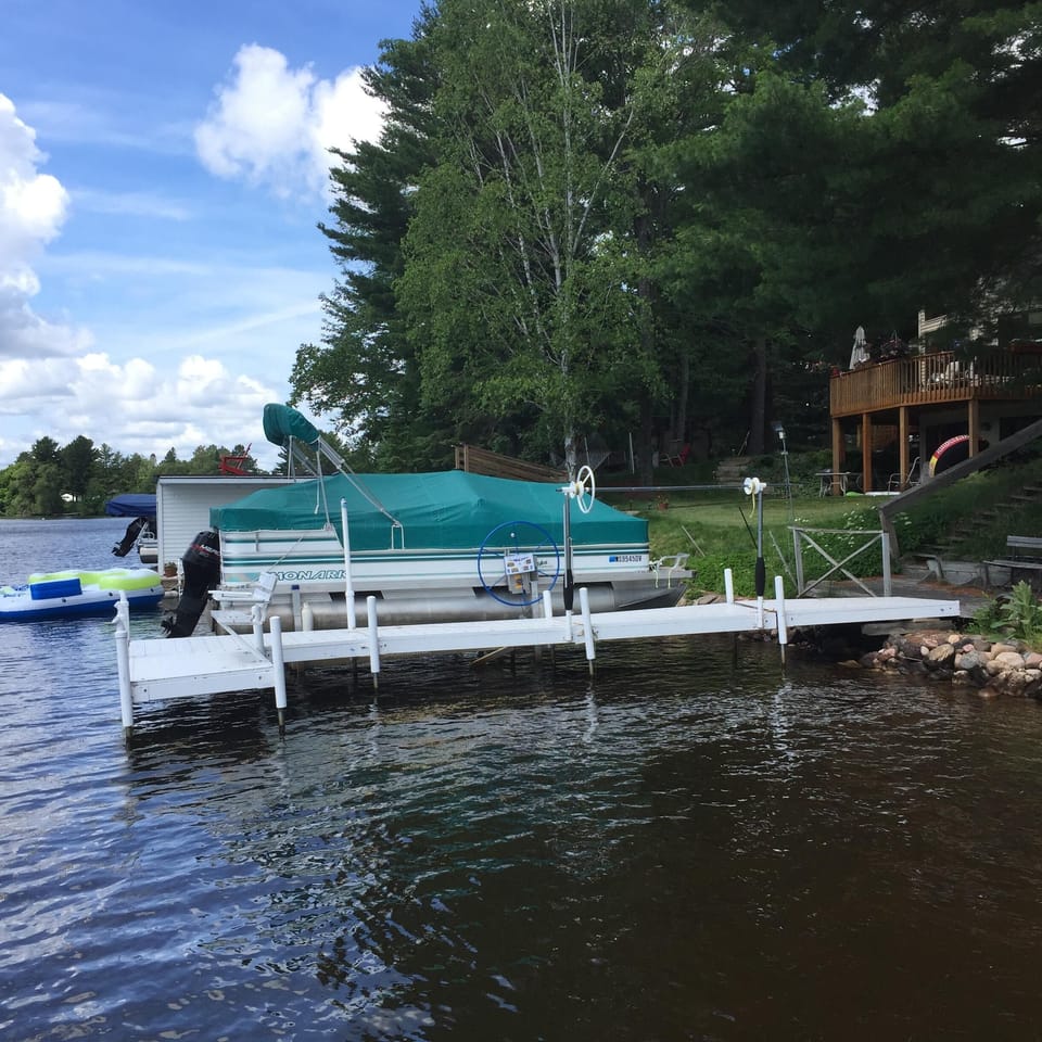Private dock and boat lift on Eagle River Chain