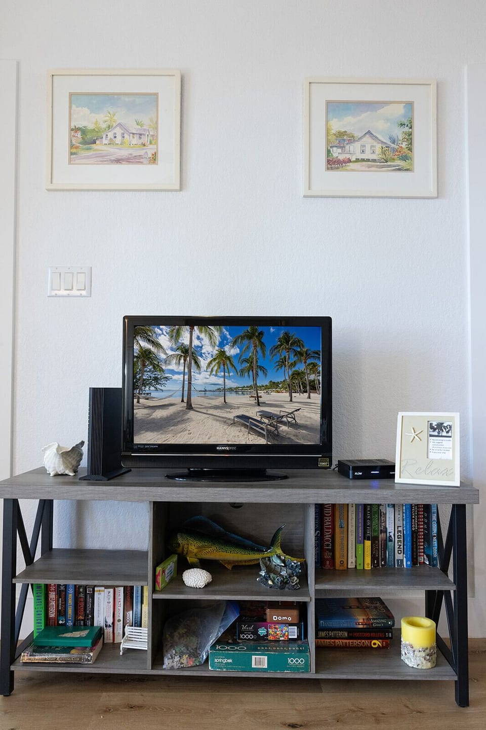 TV in living room looks out to the pool area