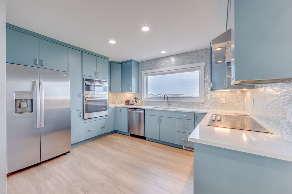 Cook dinner in the modern, well-equipped kitchen with plenty of room to move around.